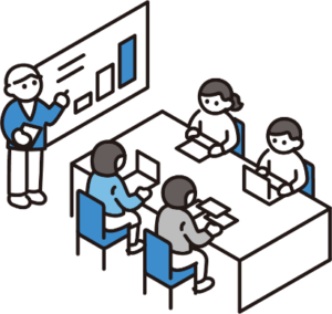 会議室でモニターとパソコンを見ながら会議をする人々