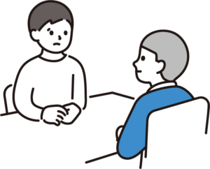 1対1で向かい合って話す人々