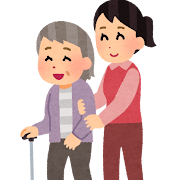 杖をついて歩く老人の女性と、介助する女性