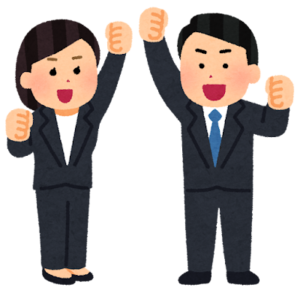 ガッツポーズをとるスーツ姿の男性と女性