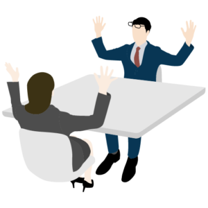 机に向かい合って活発に話すビジネスマン